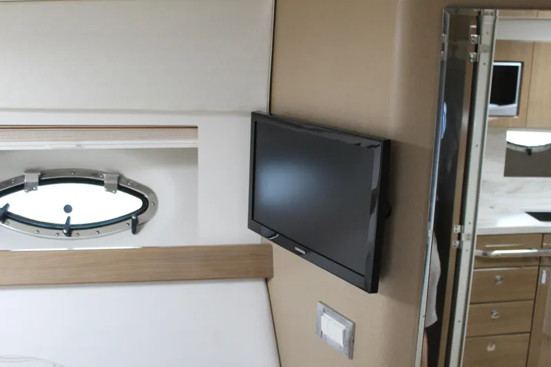 Slide: The Image of Interior of 2016 Formula 37 PC yacht with wall-mounted TV and porthole window. - 29