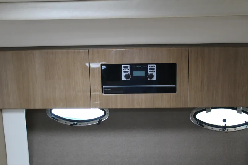 Slide: The Image of 2016 Formula 37 PC interior with wood cabinetry and built-in control panel. - 32