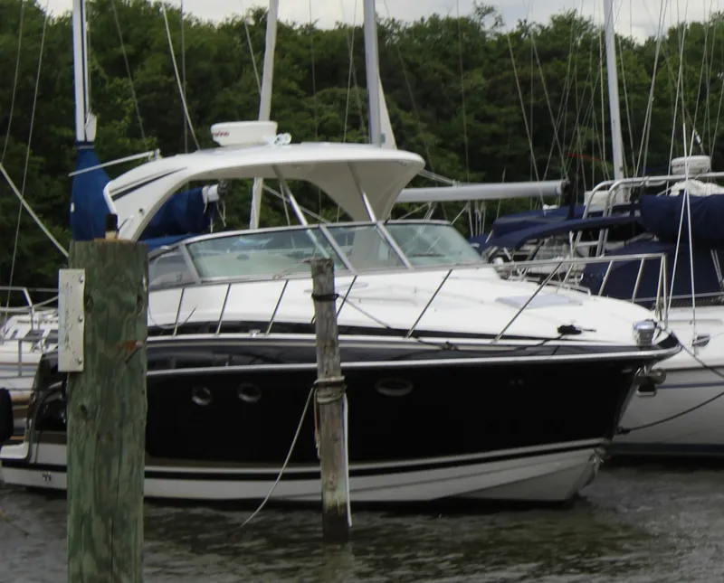 Slide: The Image of 2016 Formula 37 PC yacht docked in a marina with surrounding sailboats. - 4