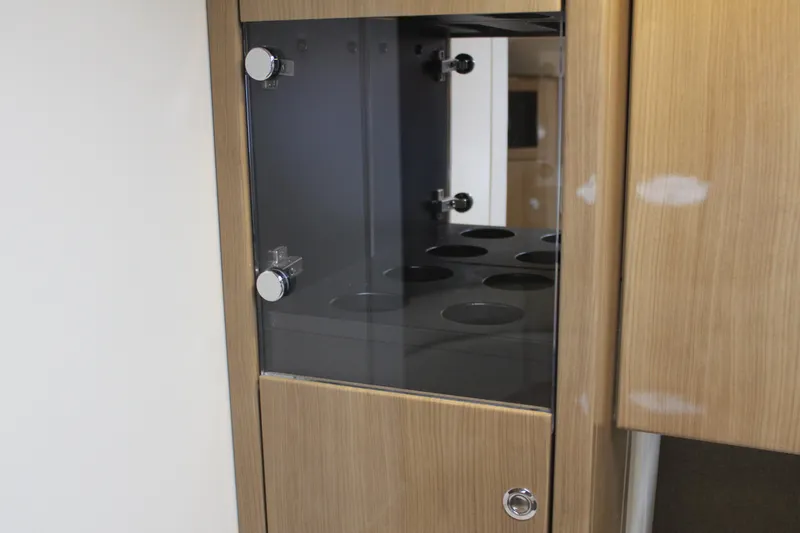 Slide: The Image of 2016 Formula 37 PC interior cabinet with glass door and cup holders. - 41