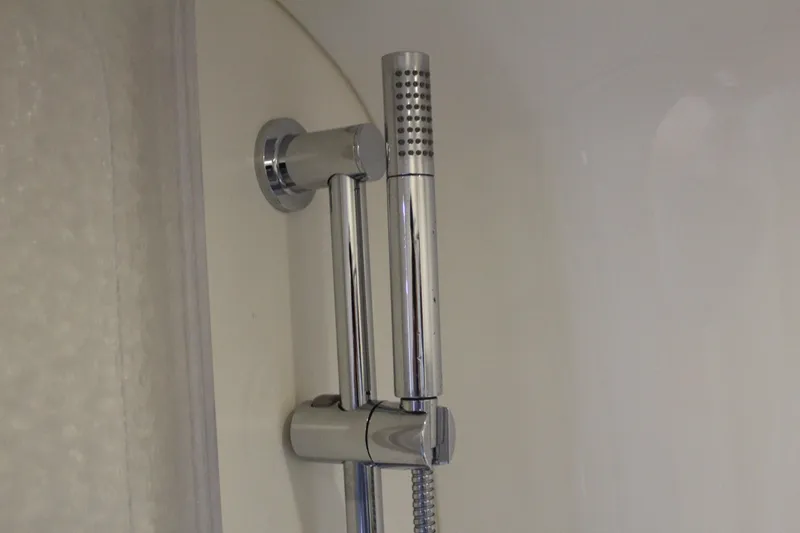Slide: The Image of Modern chrome shower fixture in a 2016 Formula 37 PC yacht bathroom. - 44