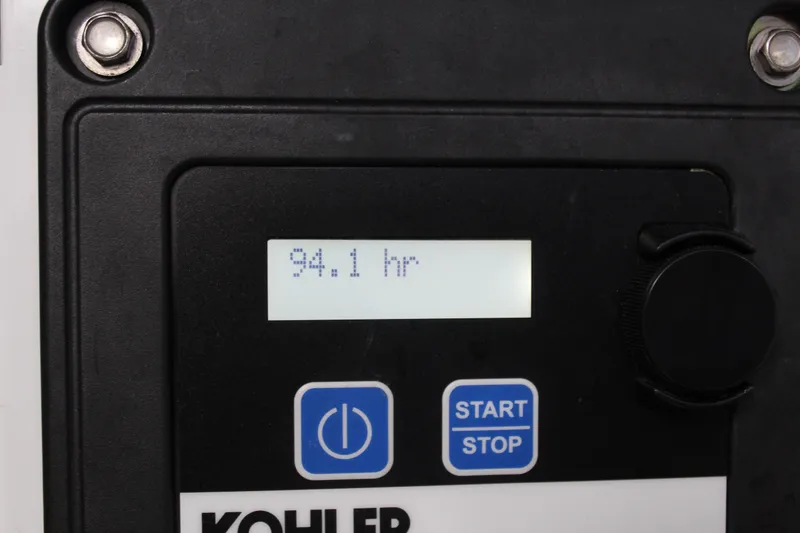 Slide: The Image of Kohler generator display showing 94.1 hours on a 2016 Formula 37 PC. - 49