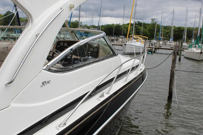 Slide: The Image of 2016 Formula 37 PC yacht docked at a marina with sailboats in the background. - 6