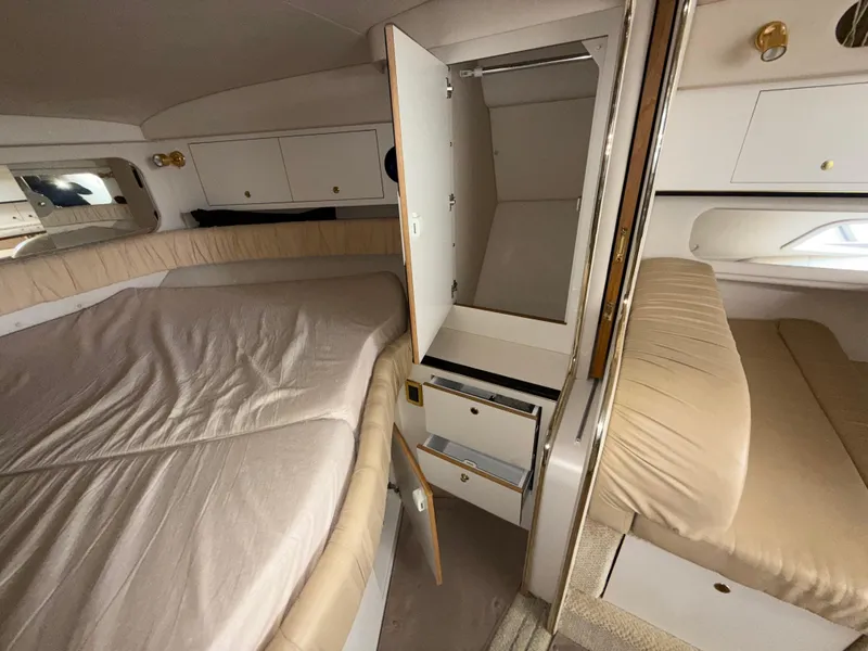 Slide: The Image of Interior cabin of 2001 Sea Ray 340 Amberjack with beds and storage compartments. - 23