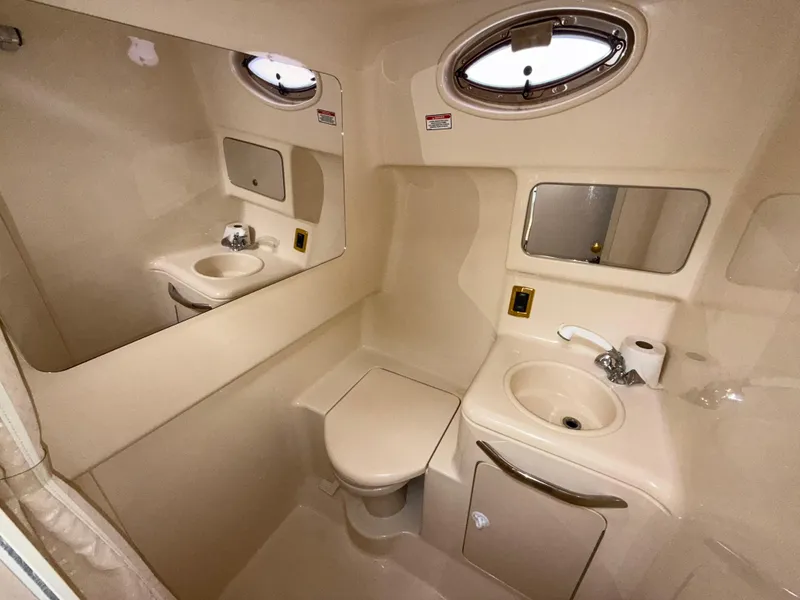 Slide: The Image of 2001 Sea Ray 340 Amberjack bathroom with sink, toilet, and mirror. - 25