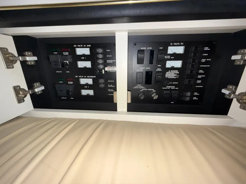 Slide: The Image of Electrical control panel inside a 2001 Sea Ray 340 Amberjack boat. - 26