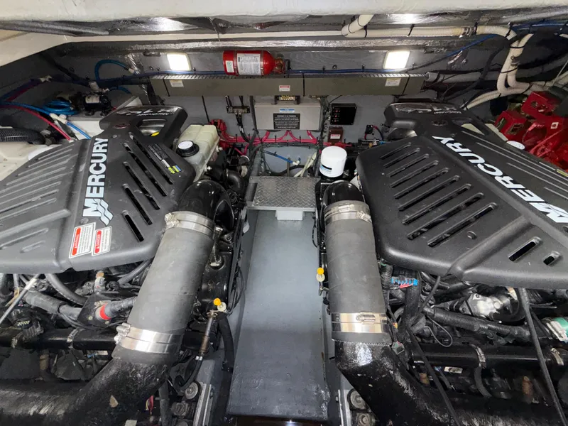Slide: The Image of Engine room of 2001 Sea Ray 340 Amberjack with dual Mercury engines. - 27