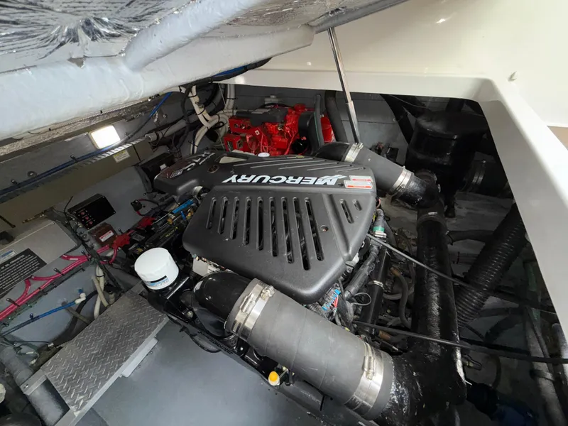 Slide: The Image of Engine room of 2001 Sea Ray 340 Amberjack with Mercury engine components. - 29