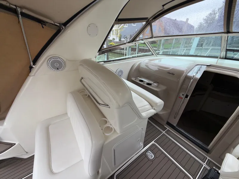 Slide: The Image of 2001 Sea Ray 340 Amberjack boat interior with white seating and dashboard. - 3