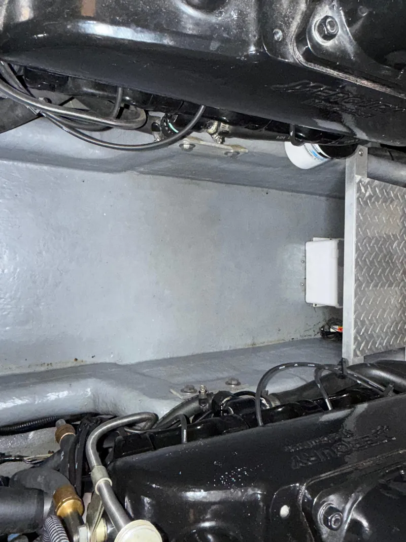 Slide: The Image of Engine compartment of 2001 Sea Ray 340 Amberjack boat, showing mechanical components and wiring. - 30