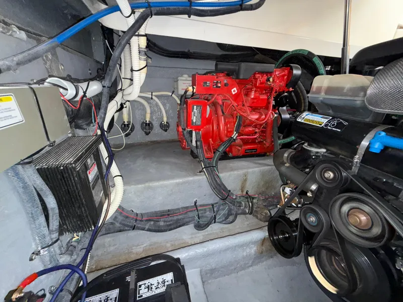 Slide: The Image of Engine room of a 2001 Sea Ray 340 Amberjack with visible machinery and wiring. - 32