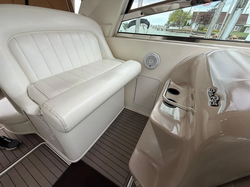Slide: The Image of 2001 Sea Ray 340 Amberjack interior with white seating and helm details. - 5