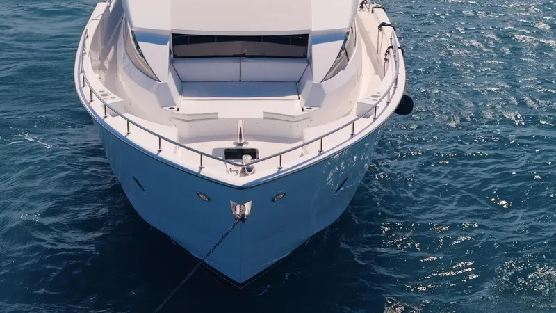 Slide: The Image of Front view of 2017 Hatteras M75 Panacera yacht on blue ocean water. - 10