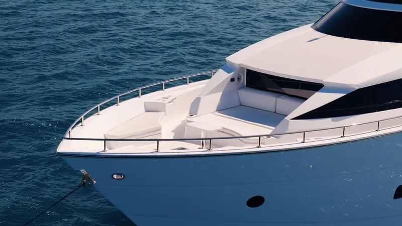 Slide: The Image of 2017 Hatteras M75 Panacera yacht on calm blue ocean waters. - 12