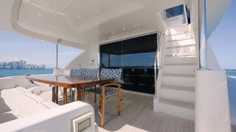 Slide: The Image of Luxurious 2017 Hatteras M75 Panacera yacht deck with seating and ocean view. - 15