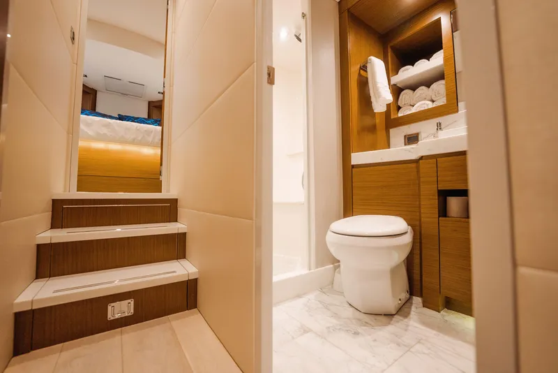Slide: The Image of Luxurious bathroom and stairs in 2017 Hatteras M75 Panacera yacht interior. - 25