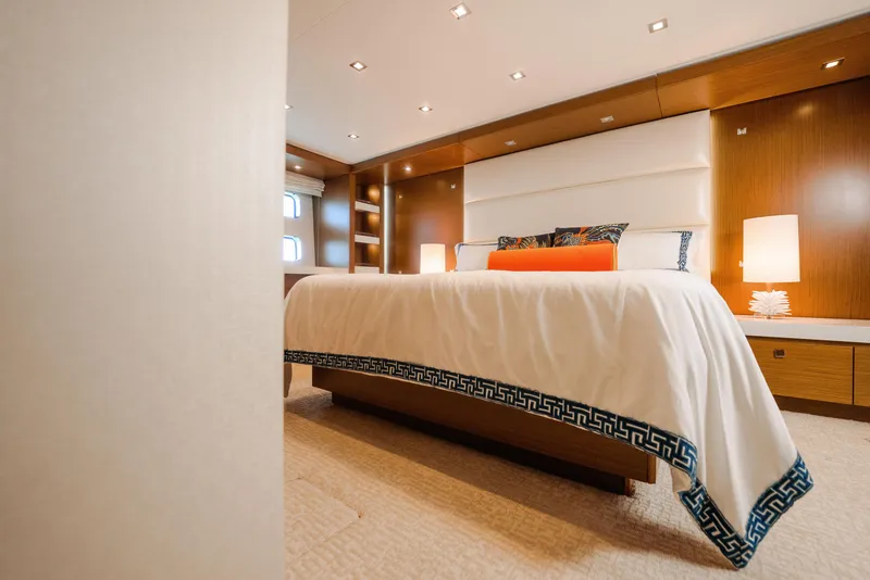 Slide: The Image of Luxurious bedroom interior of 2017 Hatteras M75 Panacera yacht with elegant bedding and warm lighting. - 30