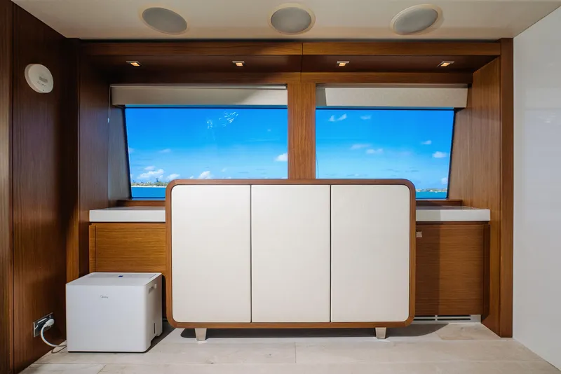 Slide: The Image of Interior of 2017 Hatteras M75 Panacera yacht with wooden cabinetry and ocean view. - 36