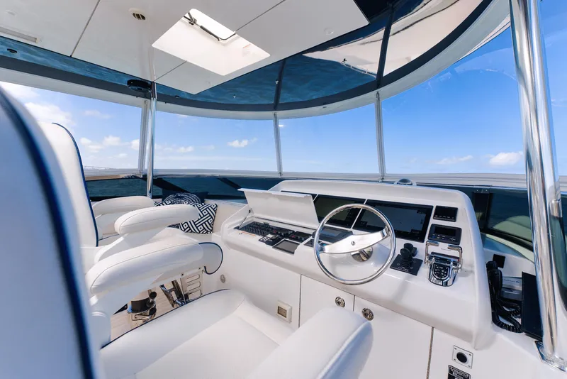 Slide: The Image of Luxurious helm of 2017 Hatteras M75 Panacera yacht with modern controls and panoramic view. - 46