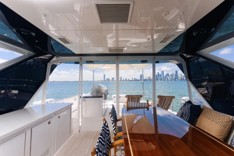 Slide: The Image of Luxurious 2017 Hatteras M75 Panacera yacht interior with ocean view and city skyline. - 48