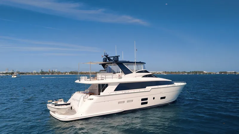 Slide: The Image of 2017 Hatteras M75 Panacera yacht cruising on open water under clear blue skies. - 6