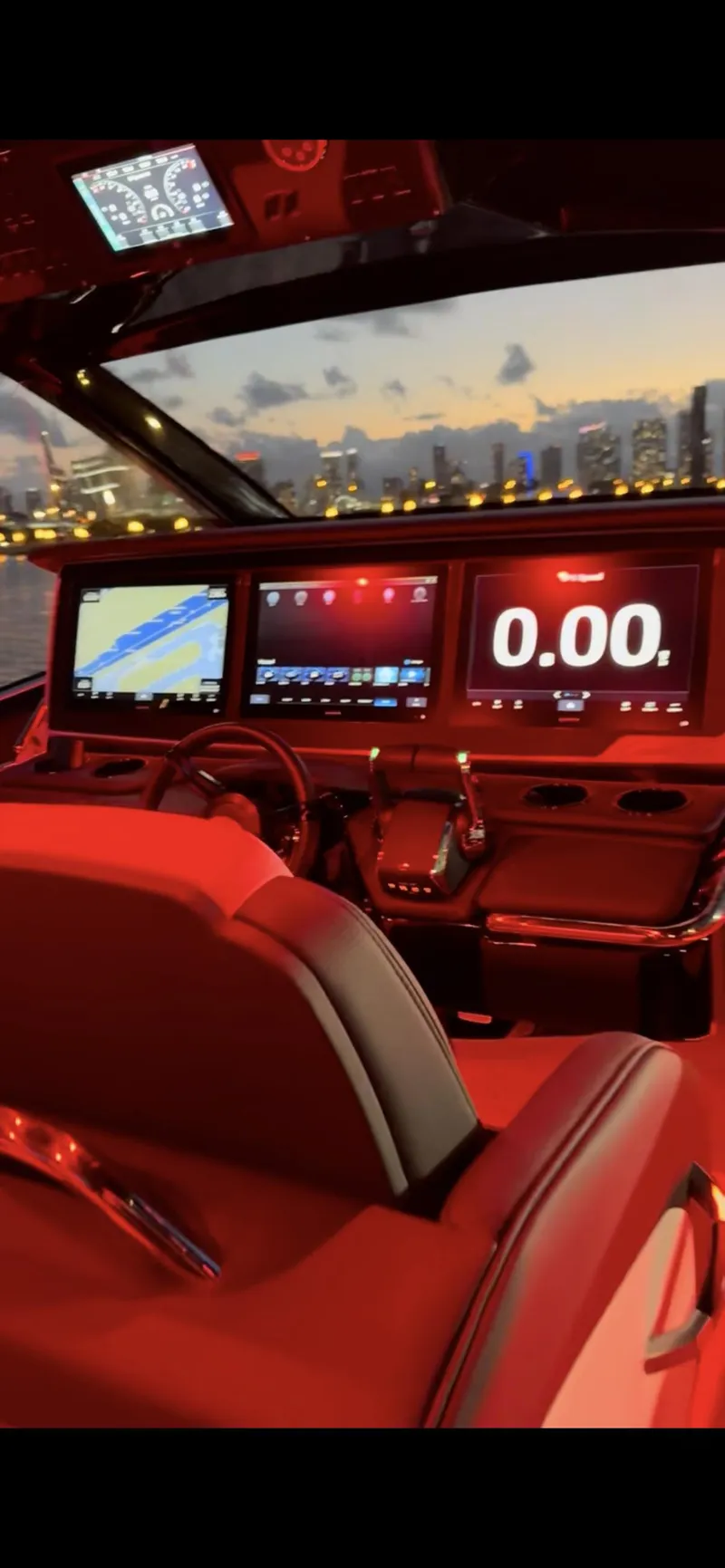 Slide: The Image of 2024 Cigarette 42 Auroris cockpit with illuminated dashboard at sunset. - 19