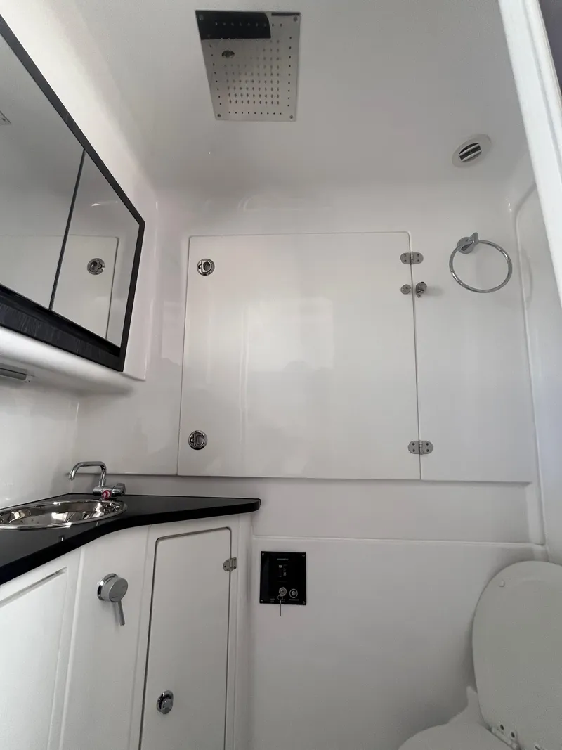 Slide: The Image of 2024 Cigarette 42 Auroris boat bathroom with sleek white interior and modern fixtures. - 23