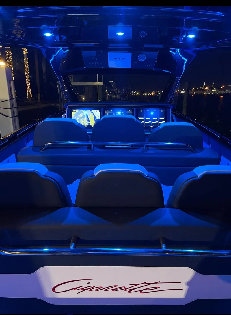 Slide: The Image of 2024 Cigarette 42 Auroris boat interior with blue LED lighting at night. - 30
