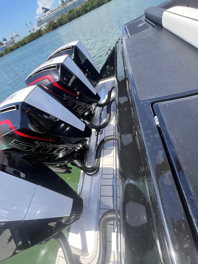 Slide: The Image of 2024 Cigarette 42 Auroris boat with powerful engines docked by the water. - 32