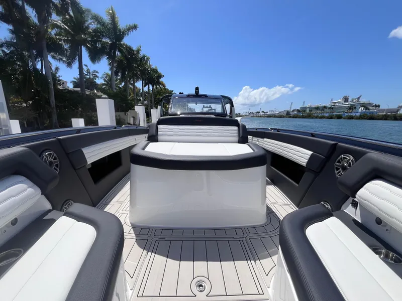 Slide: The Image of 2024 Cigarette 42 Auroris luxury boat interior with sleek seating and waterfront view. - 34