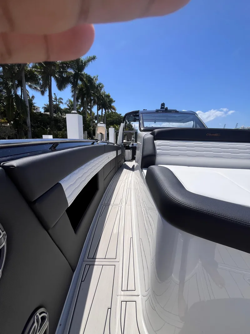 Slide: The Image of 2024 Cigarette 42 Auroris luxury boat docked under clear blue sky. - 37