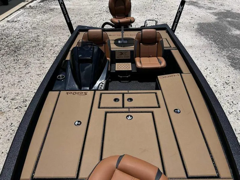 Slide: The Image of 2025 Xpress H20C Crappie boat with tan seating and storage compartments. - 14
