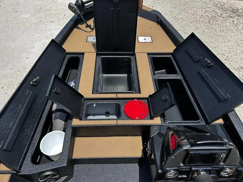 Slide: The Image of 2025 Xpress H20C Crappie boat interior with open storage compartments and fishing gear. - 16