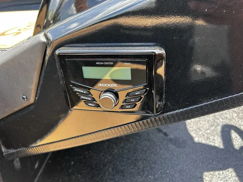 Slide: The Image of Kicker media center on 2025 Xpress H20C Crappie boat dashboard. - 17