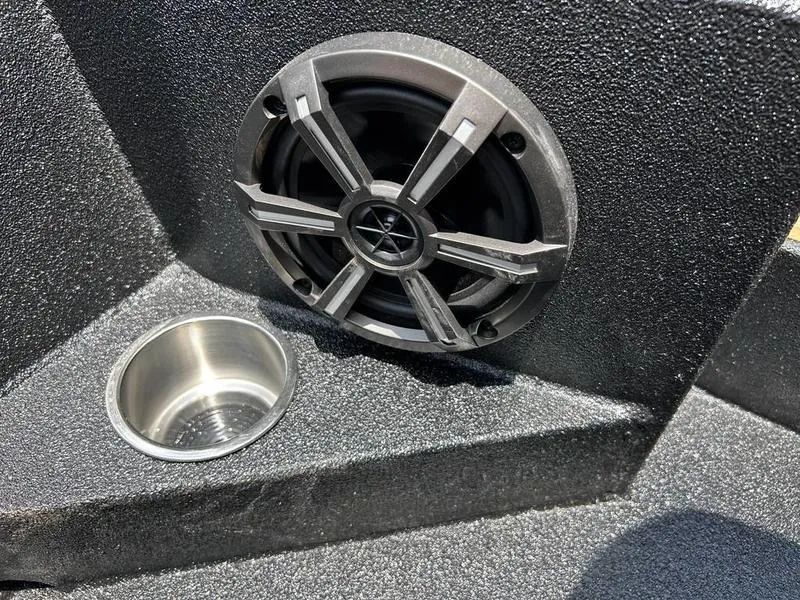 Slide: The Image of Speaker and cup holder on 2025 Xpress H20C Crappie boat interior. - 18