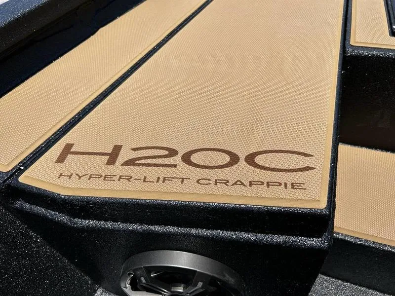 Slide: The Image of 2025 Xpress H20C Crappie boat deck with "Hyper-Lift Crappie" branding. - 19