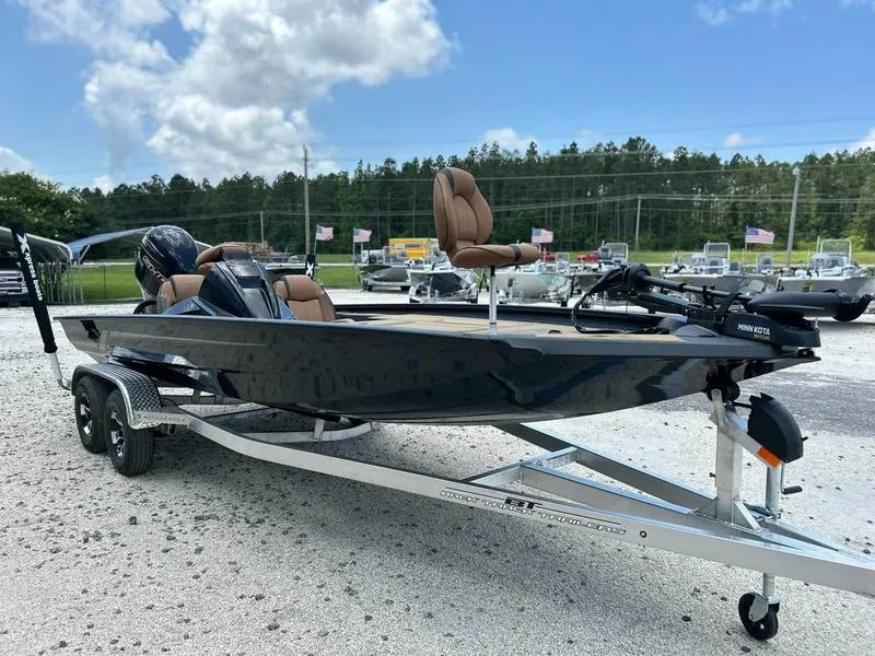 Slide: The Image of 2025 Xpress H20C Crappie boat on trailer, parked outdoors under a cloudy sky. - 8
