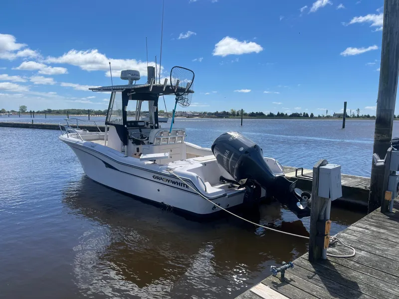 The Image of 2008 Grady-White 257 Advance CC boat docked on a sunny day. - 0