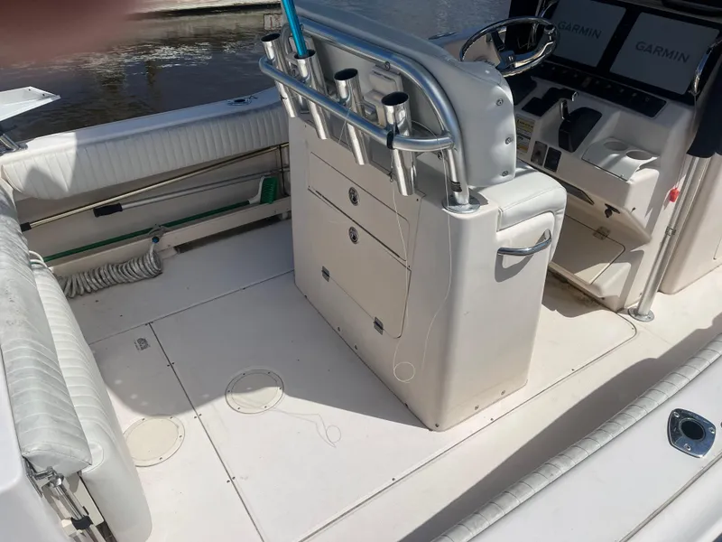 Slide: The Image of 2008 Grady-White 257 Advance CC boat interior with seating and control panel. - 7