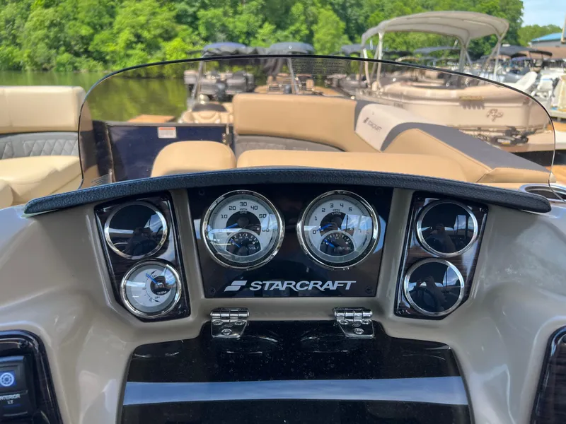 Slide: The Image of Dashboard of a 2025 Starcraft SLS 3 Q DH boat with gauges and controls. - 11