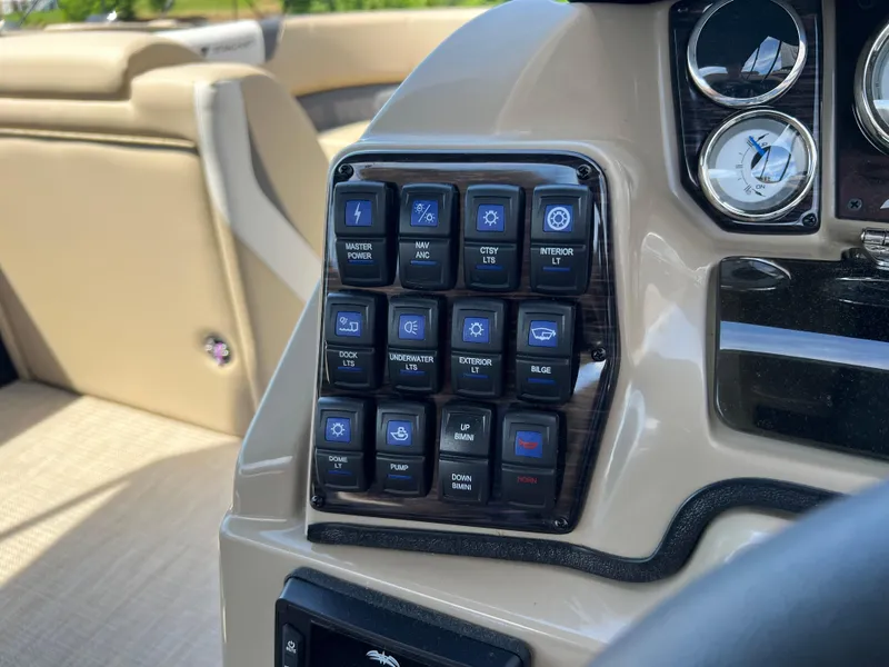 Slide: The Image of Control panel of 2025 Starcraft SLS 3 Q DH boat with various function buttons. - 12