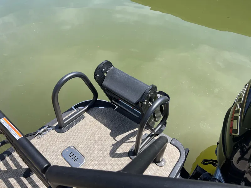 Slide: The Image of 2025 Starcraft SLS 3 Q DH boat ladder and platform by the water. - 21