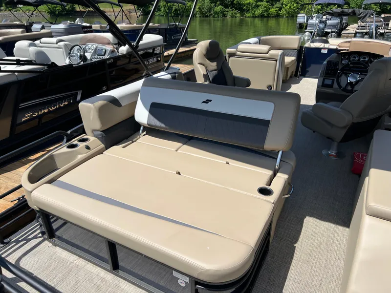 Slide: The Image of 2025 Starcraft SLS 3 Q DH pontoon boat with beige seating, cup holders, and modern design. - 22