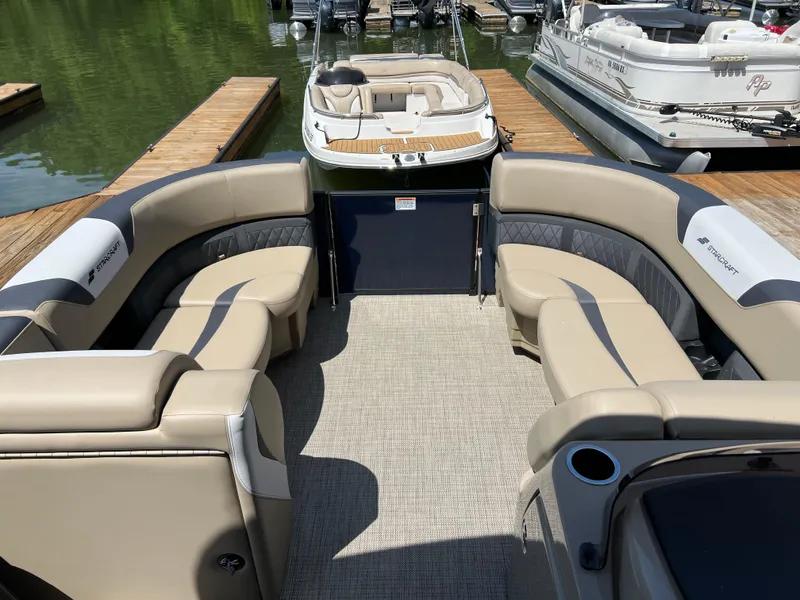 Slide: The Image of 2025 Starcraft SLS 3 Q DH pontoon boat with spacious seating and modern design. - 4
