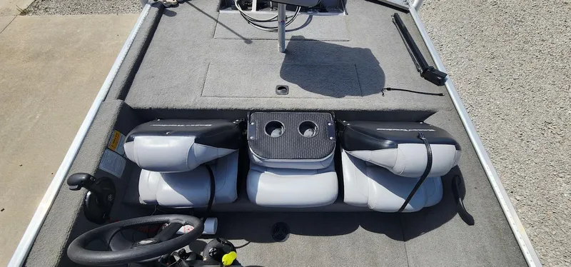 Slide: The Image of 2008 Tracker Pro Team 170 TX boat interior with steering wheel and seating. - 11