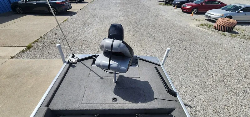 Slide: The Image of 2008 Tracker Pro Team 170 TX boat with swivel seat on gravel driveway. - 13