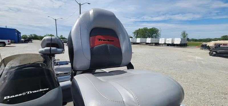 Slide: The Image of 2008 Tracker Pro Team 170 TX boat seat in a gravel lot under a blue sky. - 5