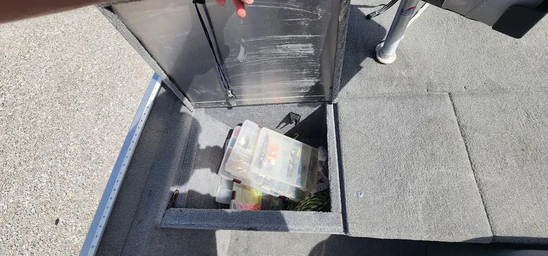 Slide: The Image of Open storage compartment on 2008 Tracker Pro Team 170 TX boat with tackle boxes inside. - 8