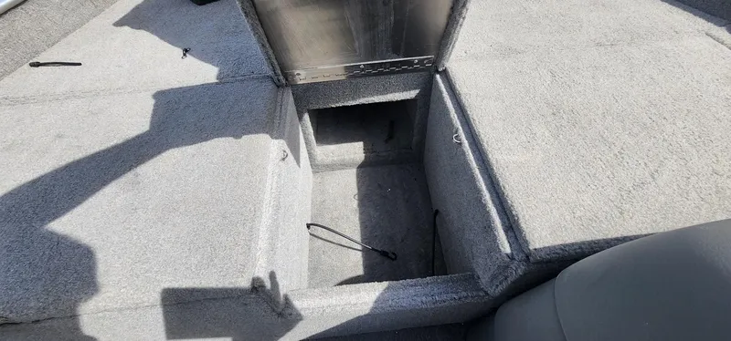 Slide: The Image of 2008 Tracker Pro Team 170 TX boat storage compartment open, showing interior space. - 9