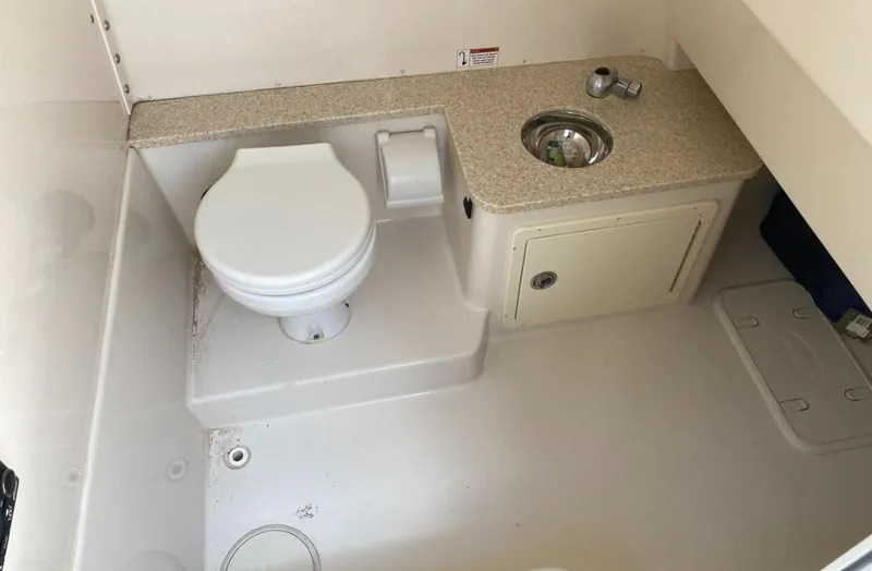 Slide: The Image of 2020 Sea Chaser 35 HFC CC boat bathroom with toilet and sink. - 15